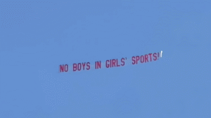 Plane flying ‘No Boys in Girls’ Sports’ banner over track meet goes viral as trans athlete dominates