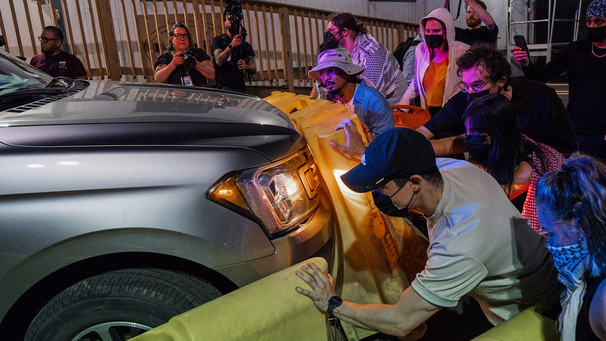 protesters with vehicle