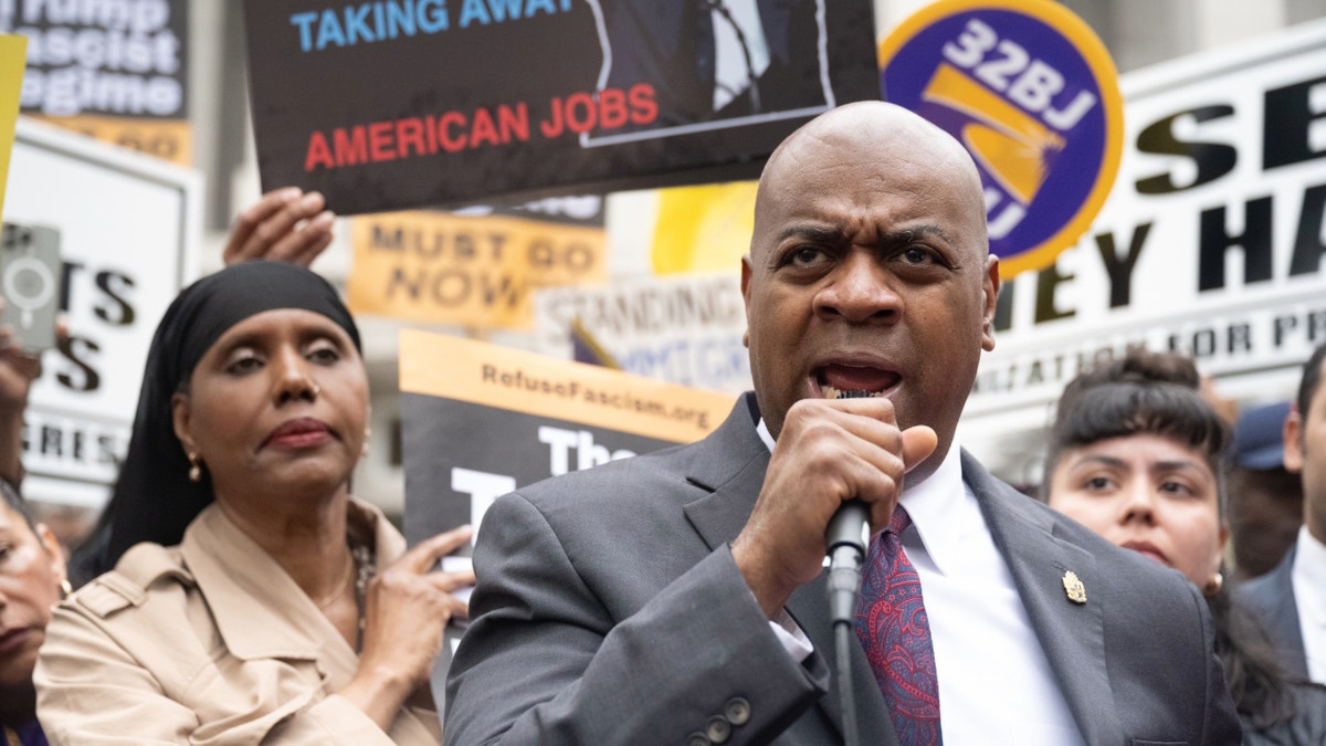 Ras Baraka holding mic at rally