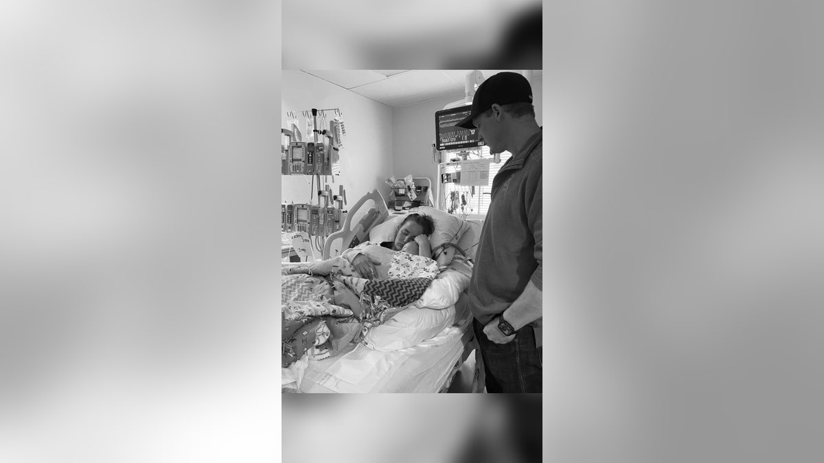 The Wright family in a hospital bed.