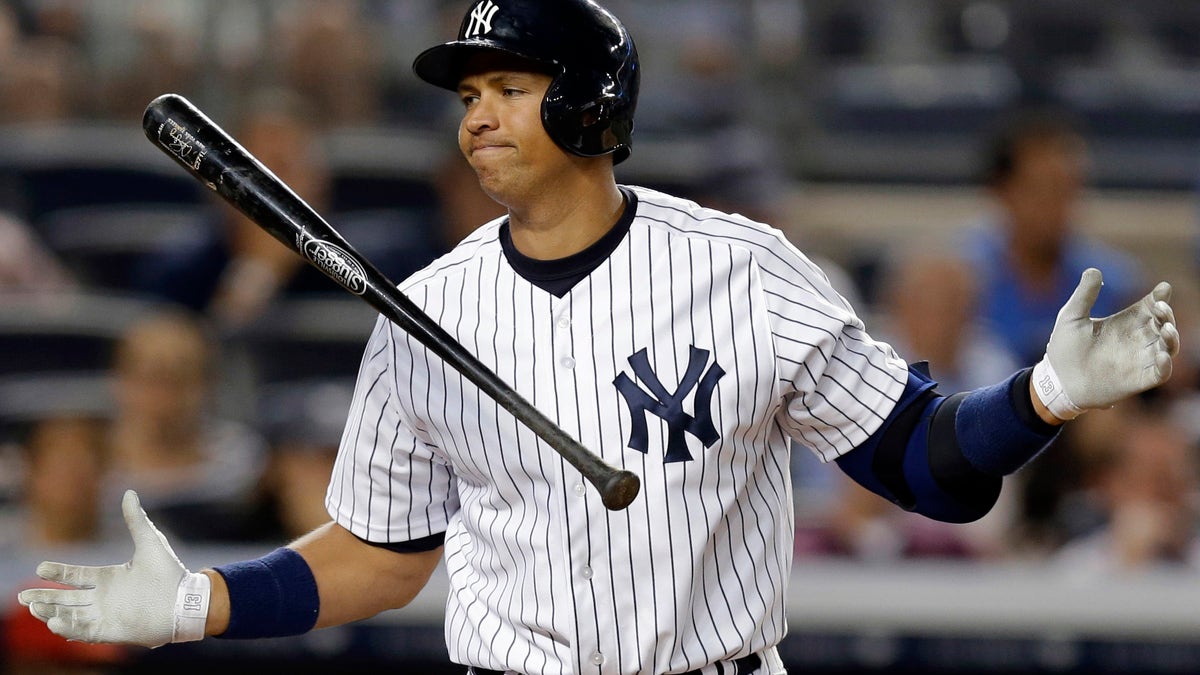FILE - In this Aug. 13, 2013, file photo, New York Yankees' Alex Rodriguez reacts after striking out in the seventh inning of a baseball game against the Los Angeles Angels in New York. Rodriguez has accepted his season-long suspension from Major League Baseball, the longest penalty in the sport's history related to performance-enhancing drugs. Rodriguez withdrew his lawsuits against MLB, Commissioner Bud Selig and the players' association to overturn his season-long suspension on Friday, Feb. 7, 2014. (AP Photo/Kathy Willens, File)