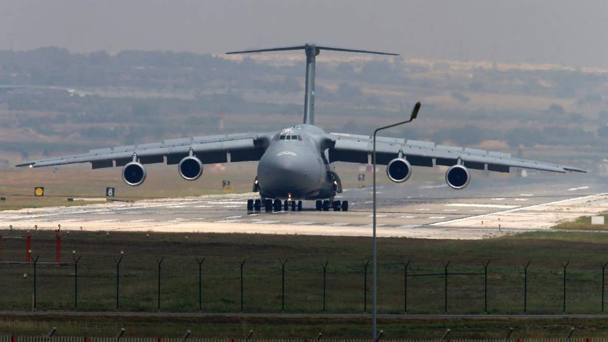 A United States Air Force cargo plane maneuvers on the runway after it landed at the Incirlik Air Base, in the outskirts of the city of Adana, southeastern Turkey, Wednesday, July 29, 2015. After months of reluctance, Turkish warplanes started striking militant targets in Syria last week, and also allowed the U.S. to launch its own strikes from Turkey's strategically located Incirlik Air Base. (AP Photo/Emrah Gurel)