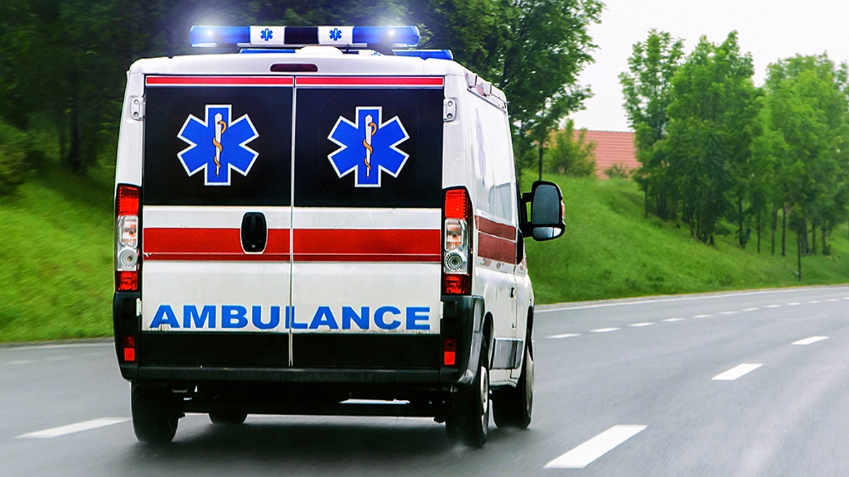 Ambulance van with flashing lights blured motion