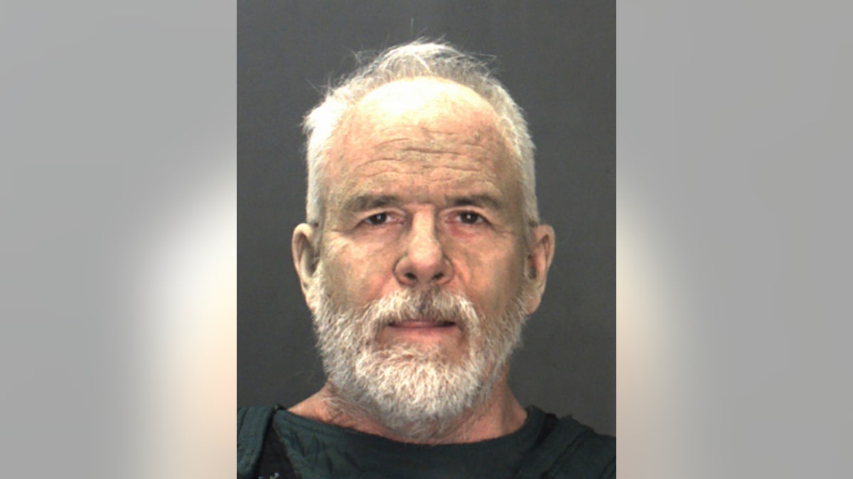 Michael Sparks has thinning gray hair and a full beard in his mugshot