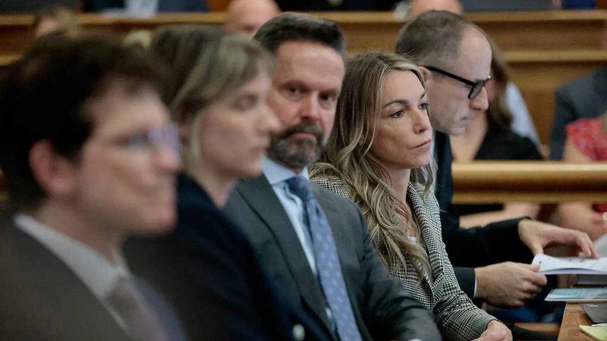 Karen Read sits with her defense team, from left, Robert Alessi, Elizabeth Little, Alan Jackson, and David Yannetti at the defense table