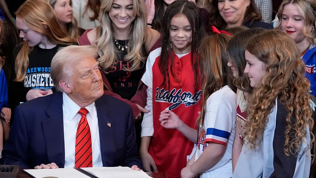 Trump signs an executive order banning transgender women from competing in women/girls sporting events on Feb. 6, 2025.