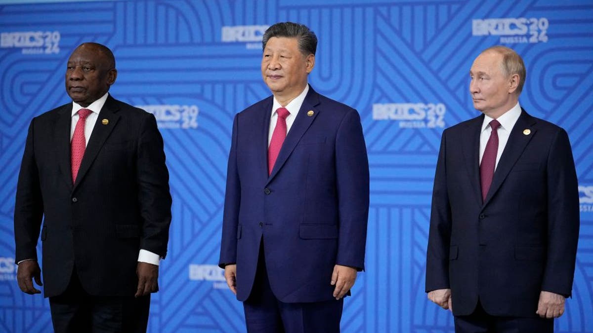 South African President Cyril Ramaphosa, Chinese President Xi Jinping and Russian President Vladimir Putin pose for a family photo during the BRICS summit in Kazan on October 23, 2024.