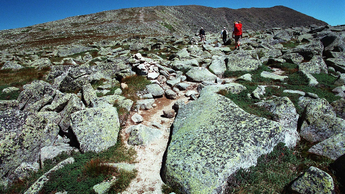 Hikers make their way across Mount Katahdin's tableland
