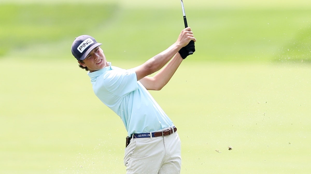 Mason Howell swings golf club