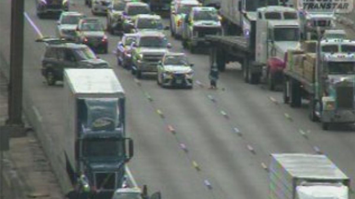 Armed woman disrupted traffic when she sat in a chair on a busy highway
