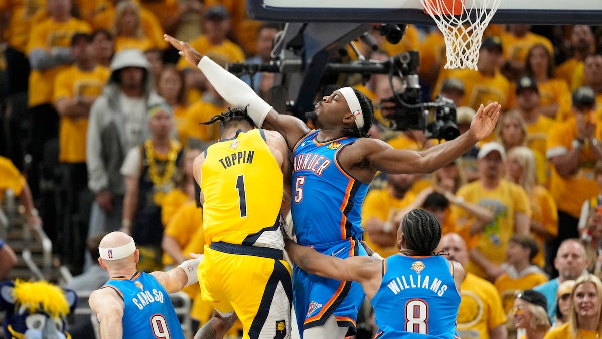 Jun 13, 2025; Indianapolis, Indiana, USA; Indiana Pacers forward Obi Toppin (1) drives to the basket against Oklahoma City Thunder guard Luguentz Dort (5) during the first half during game four of the 2025 NBA Finals at Gainbridge Fieldhouse.