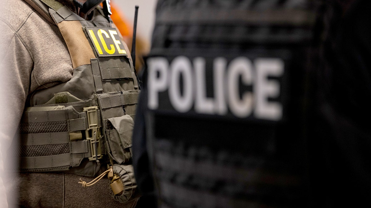 ICE agents in vests