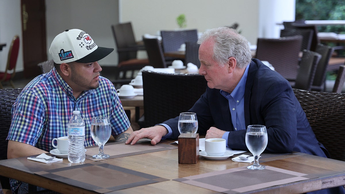 Abrego Garcia, left, with Sen. Van Hollen at table