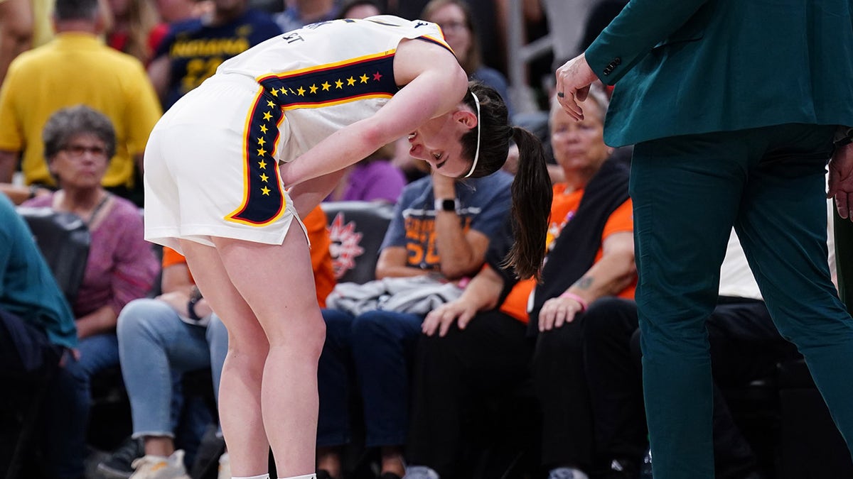 Caitlin Clark hunches over