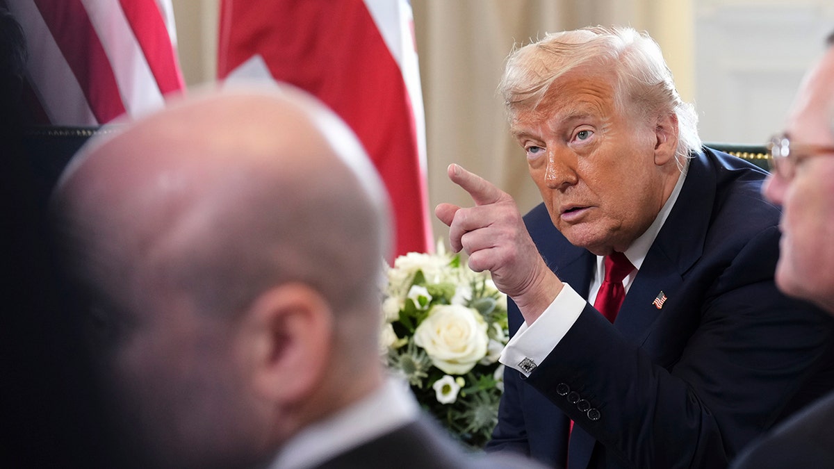 President Donald Trump speaks with the media