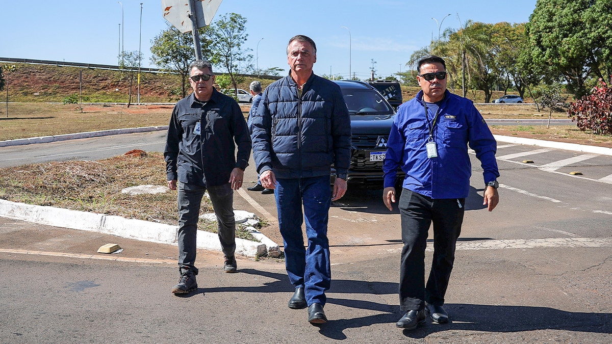 Brazil's former President Jair Bolsonaro arrives to the State Secretariat of Penitentiary Administration headquarters