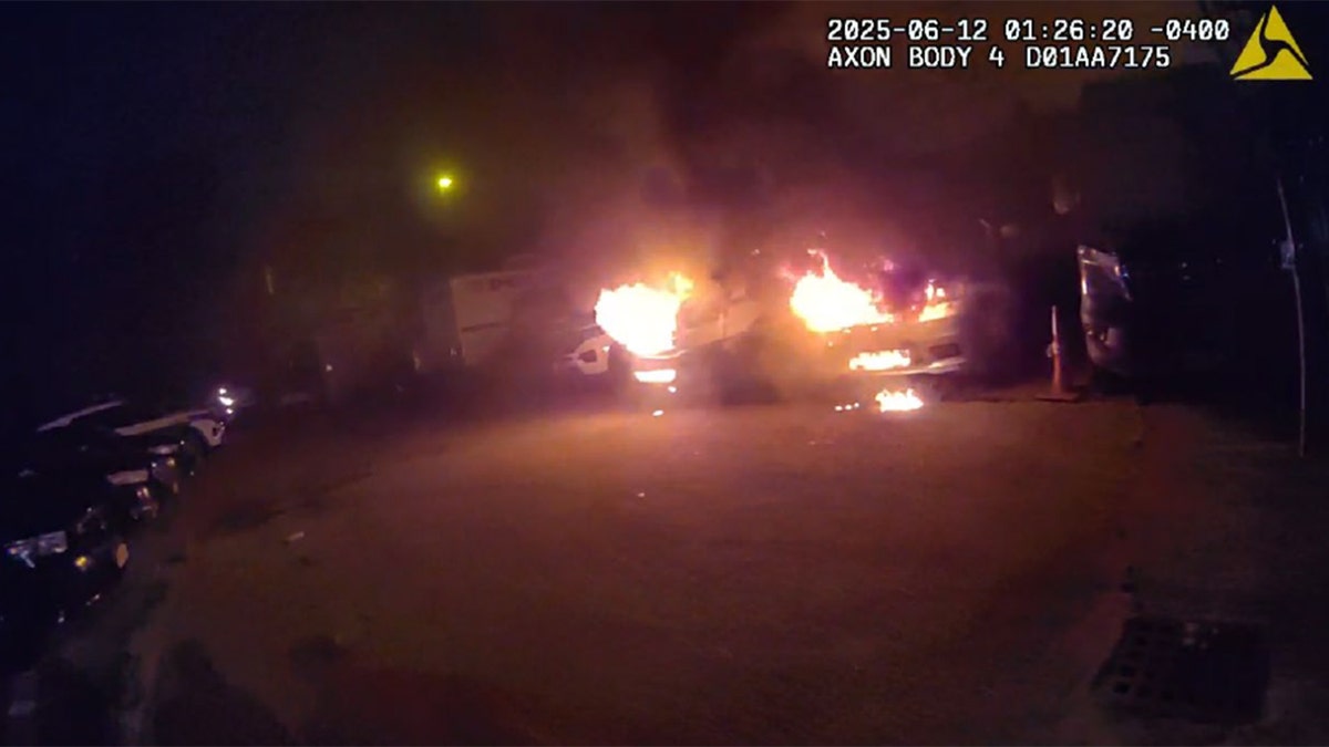 NYPD vehicles burning in Brooklyn lot at night