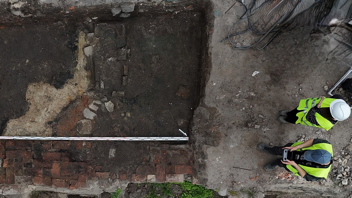 Aerial view of archaeologists looking at burial site