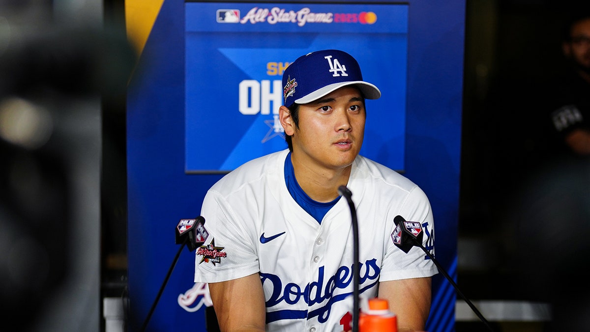 Shohei Ohtani talks to the media