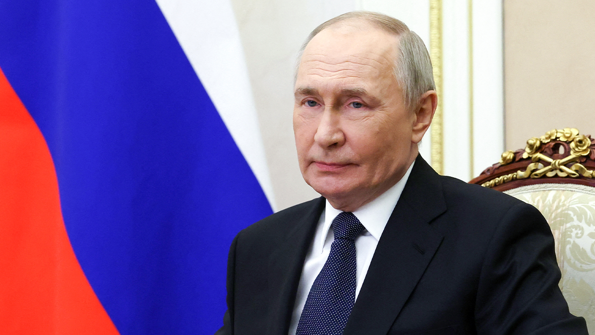 Russian President Vladimir Putin listens during a meeting at the Kremlin