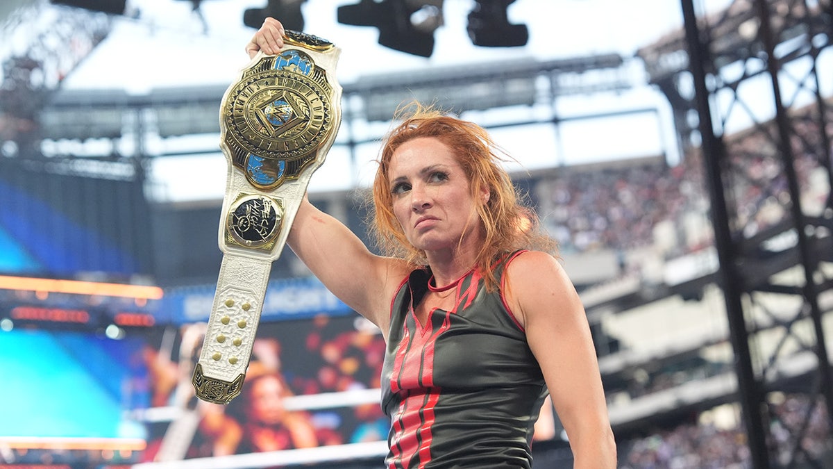 Becky Lynch with the title
