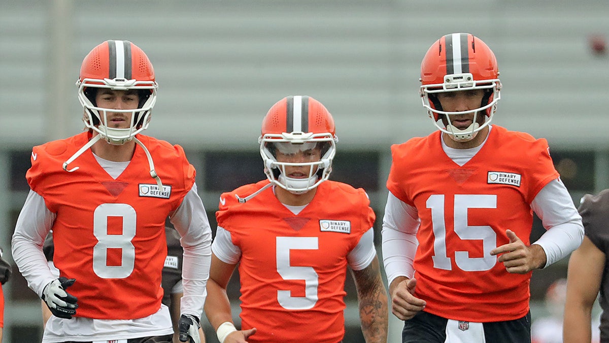 Cleveland Browns quarterbacks Kenny Pickett, left, Dillon Gabriel, center, and Joe Flacco