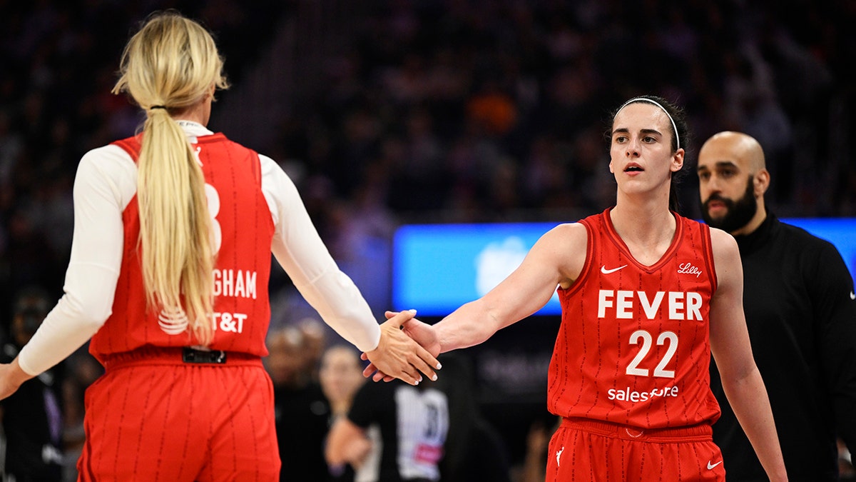 Caitlin Clark #22 of the Indiana Fever and Sophie Cunningham #8 celebrate against the Golden State Valkyries in the first quarter at Chase Center on June 19, 2025 in San Francisco, California.