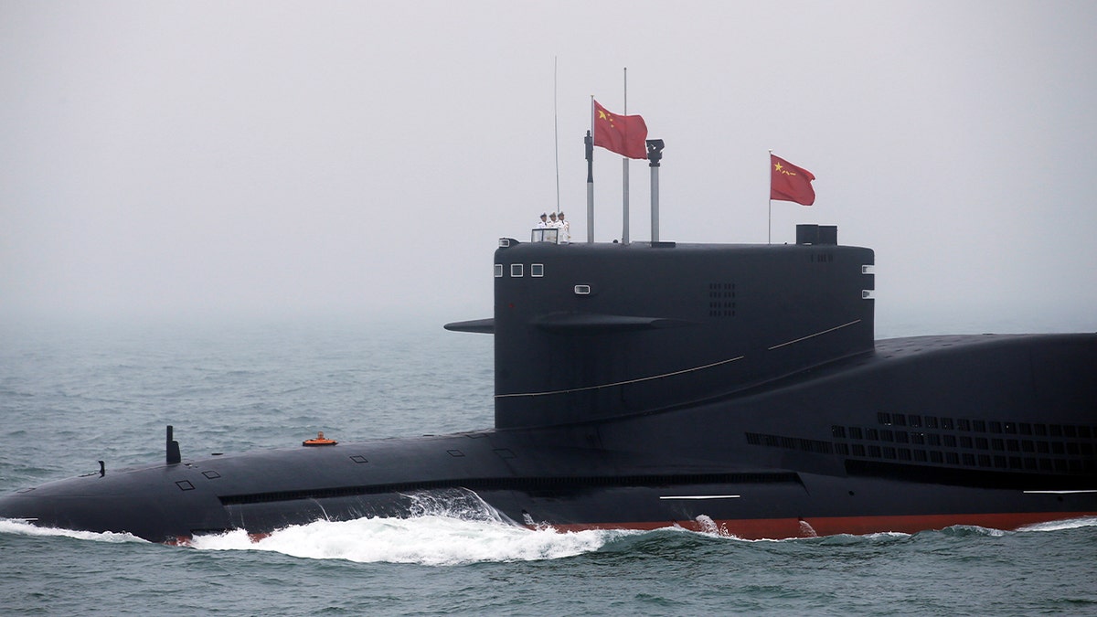 Chinese Navy's nuclear-powered submarine Long March 11 takes part in a naval parade off the eastern port city of Qingdao, to mark the 70th anniversary of the founding of Chinese People's Liberation Army Navy, China, April 23, 2019.