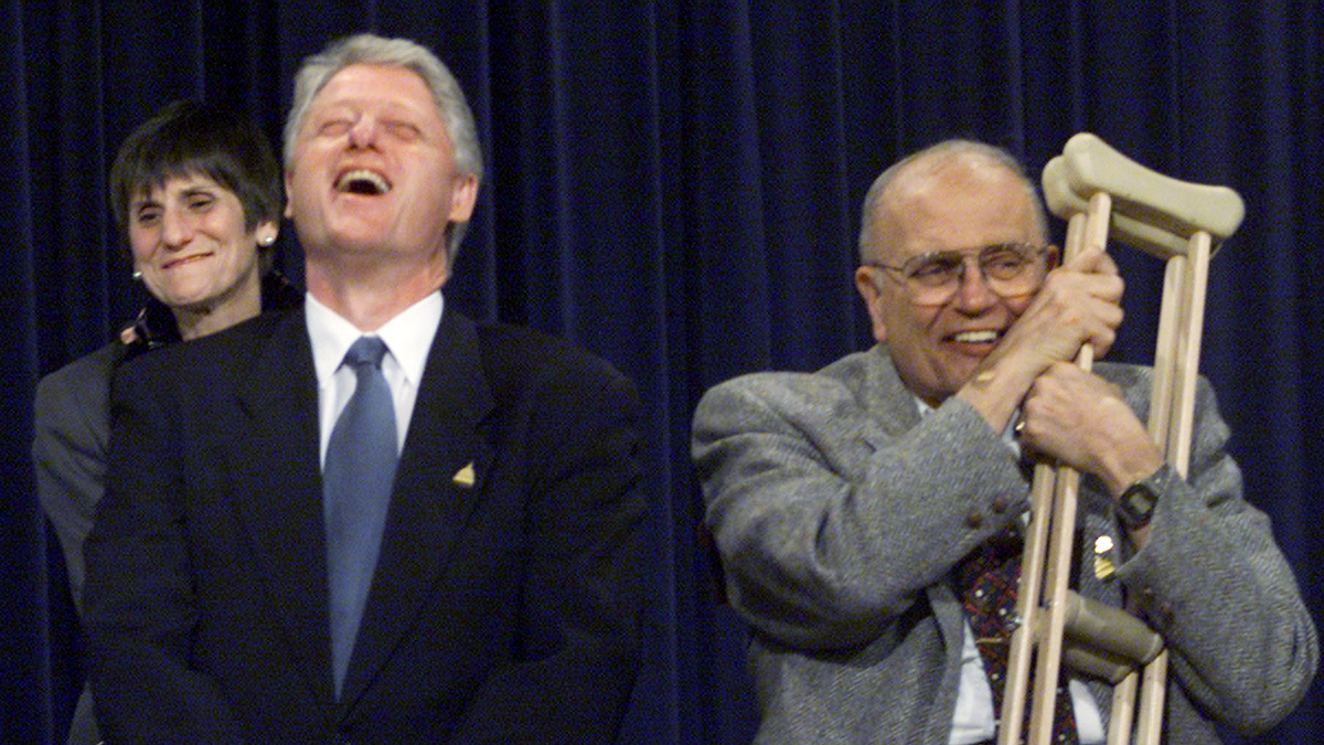 Bill Clinton and John Dingell Jr.