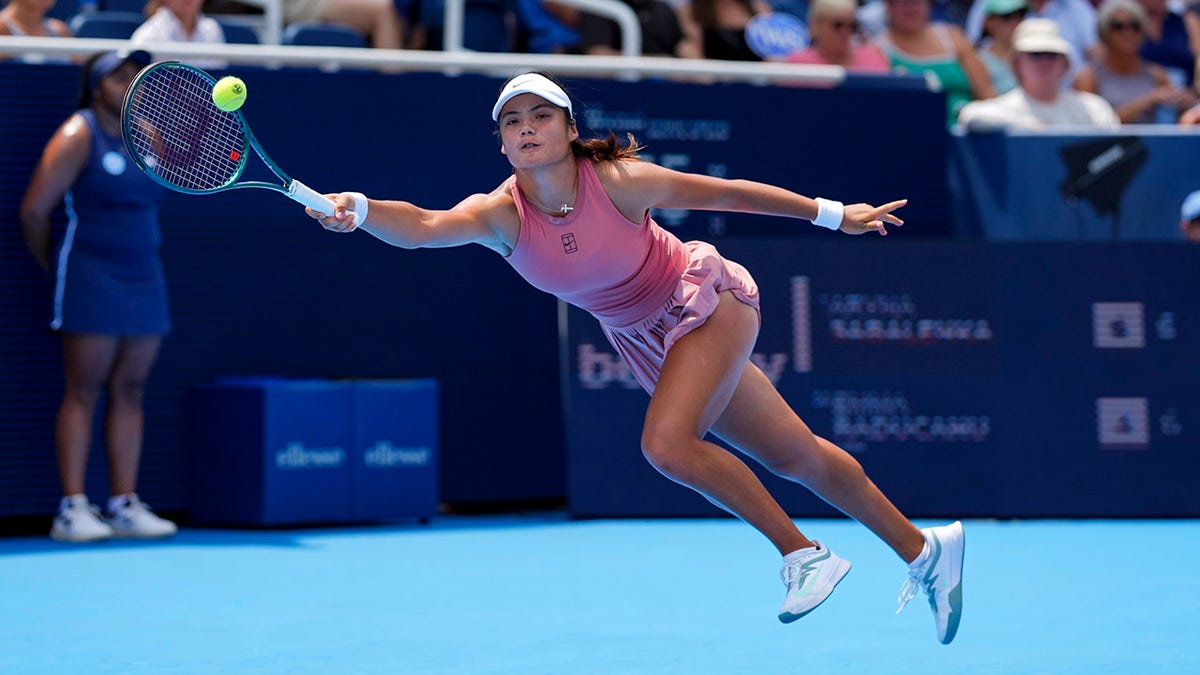 Emma Raducanu swings tennis reacket