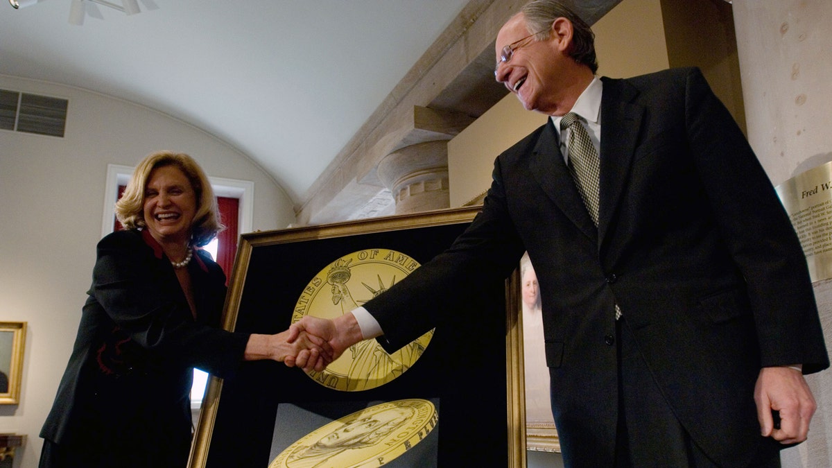 Mike Castle shakes hands with Carolyn Maloney