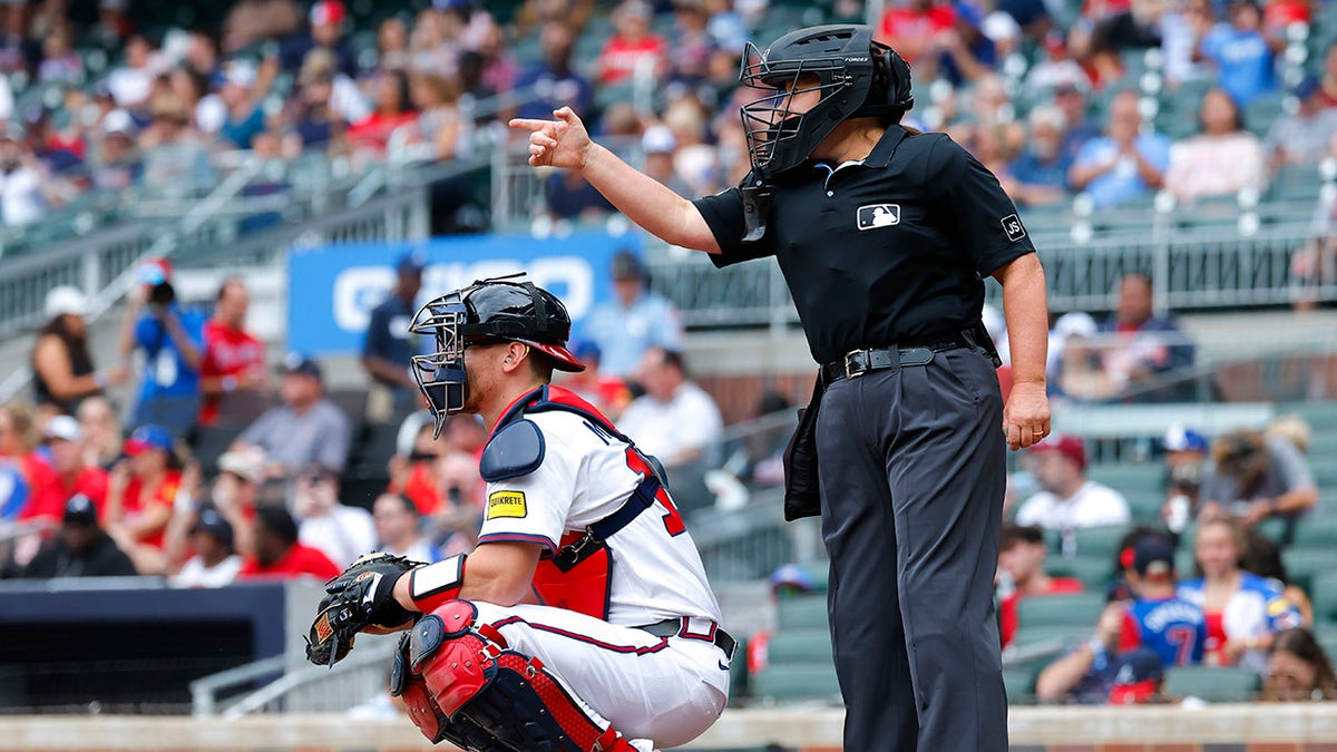Jen Pawol calls strike behind home plate