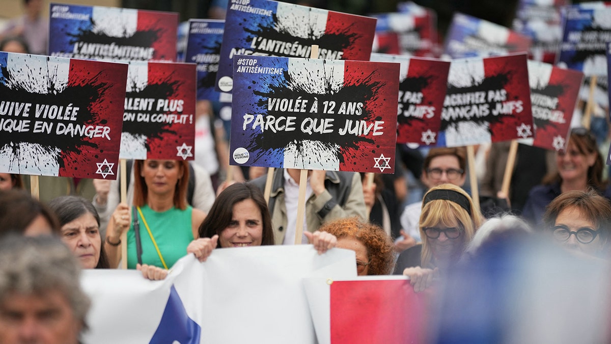 Protesters march after a young Jewish girl was gang raped in an antisemitic attack
