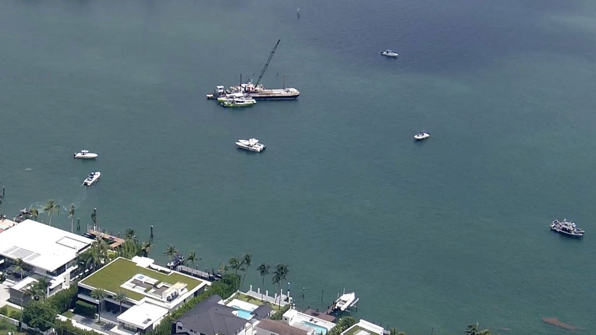 Boats and a barge in water