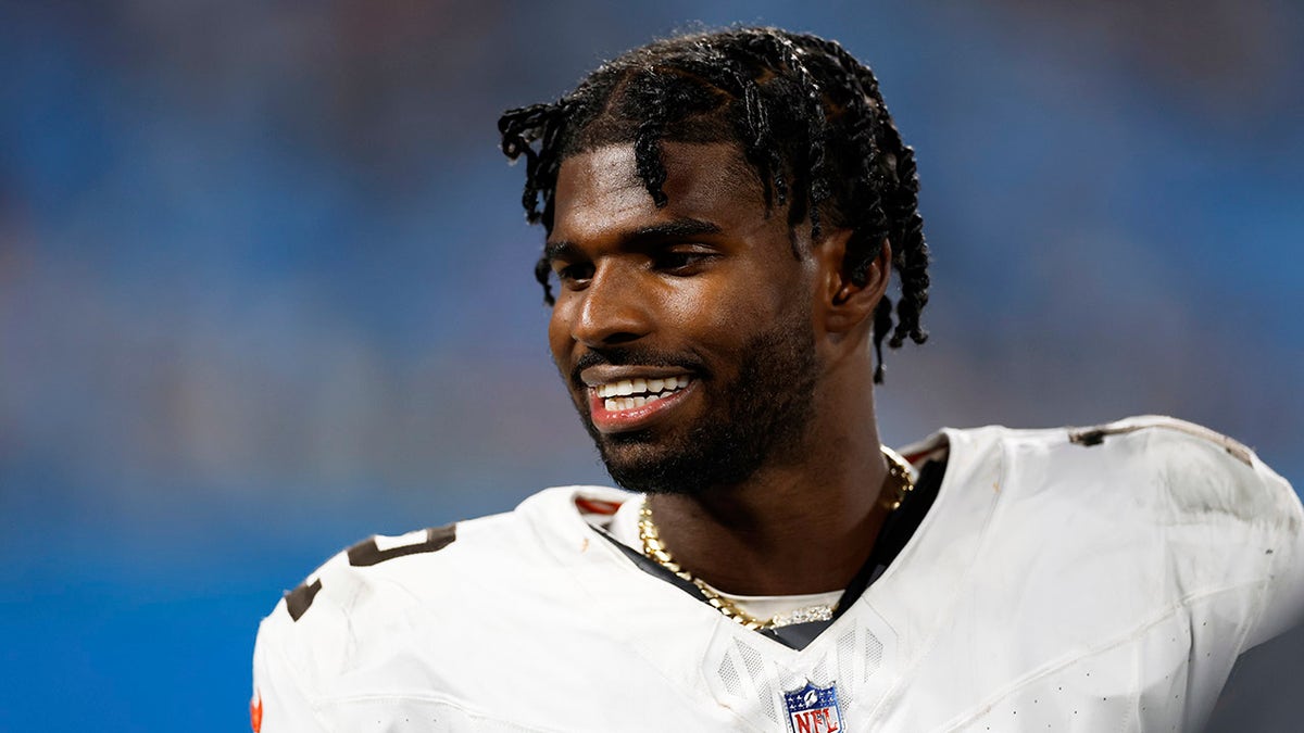 Shedeur Sanders looks on