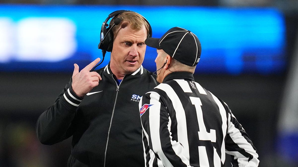 Rhett Lashlee talks to referee
