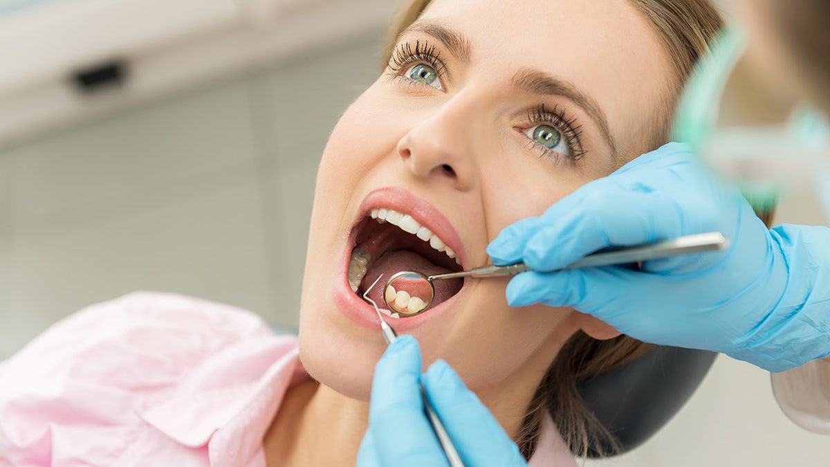 Woman being examined at the dentist