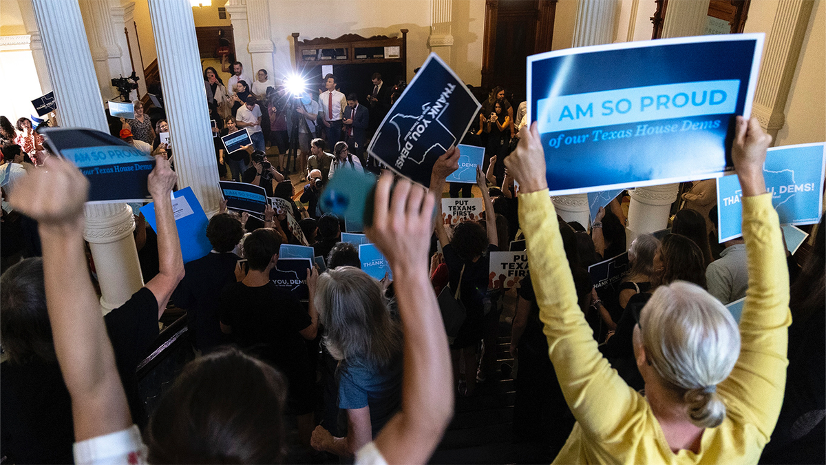Supporters for the returning Texas democrats chant as members enter the house at the Texas Capitol in Austin, Texas, Monday, Aug. 18, 2025.