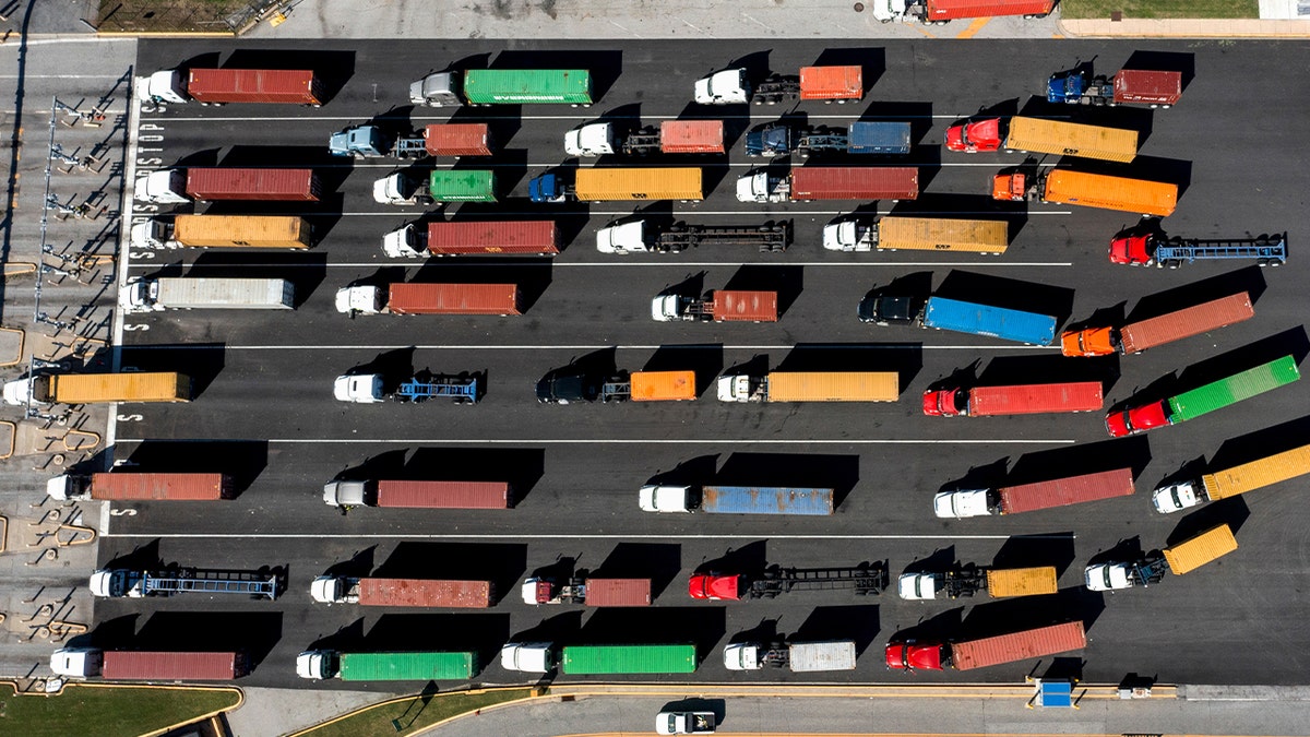 Tractor trailers at the entrance of the Port of Baltimore in Baltimore, Maryland, US, on Tuesday, Oct. 8, 2024.