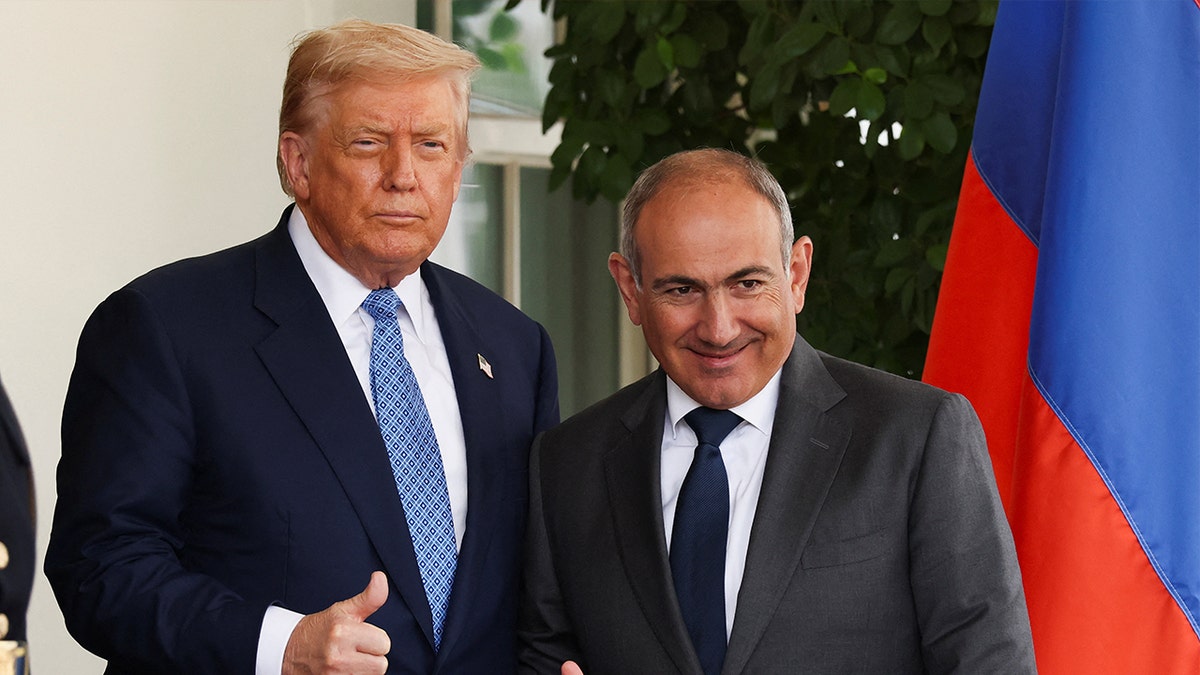U.S. President Donald Trump and Armenia's Prime Minister Nikol Pashinyan give a thumbs up as Pashinyan arrives for a meeting at the White House, in Washington, D.C., August 8, 2025