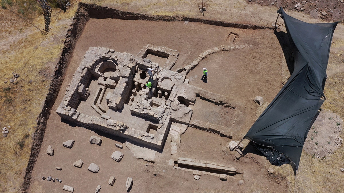 Bird's eye view of archaeologists working on site
