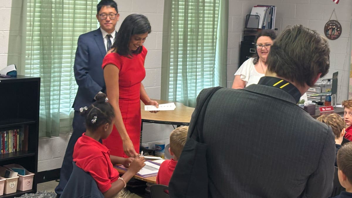Usha Vance is pictured on Thursday with schoolchildren in Georgia as part of her reading initiative for kids. "She uses her voice to tell people how important it is to keep children safe and to make sure that they grow up happy and healthy," Ms. Vance said in part about first lady Melania Trump. 
