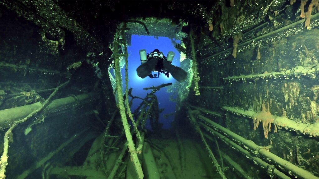 Eerie images show century-old wreck of Titanic’s sister ship as divers recover artifacts for first time