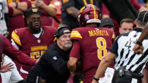 Commanders’ Dan Quinn left bloodied after quarterback runs into him during play