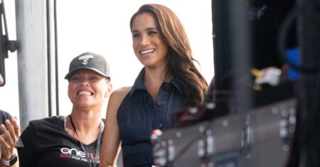 Meghan Markle Shows Off California Elegance in Navy Dress at Surprise Appearance With Prince Harry