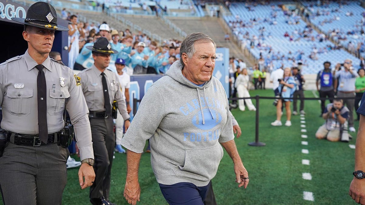 Bill Belichick walks on field