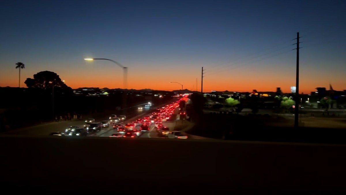 Cars line up ahead of Charlie Kirk's memorial service in Glendale, Arizona.
