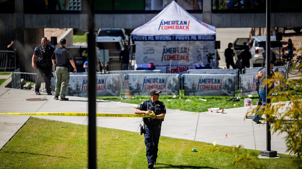 Police the scene after the shooting of Charlie Kirk at a college.