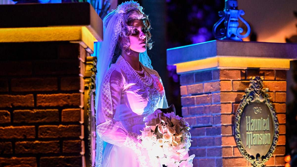 Constance Hatchaway, also known as The Black Widow Bride, a character from The Haunted Mansion ride at Disneyland, during the Frightfully Fun Parade at Oogie Boogie Bash, A Disney Halloween Party, in California Adventure at the Disneyland Resort in Anaheim, CA, on Thursday, September 9, 2021.