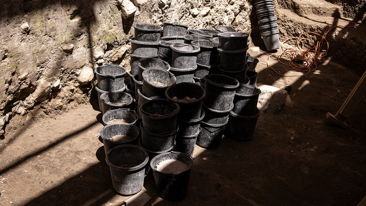 Buckets at site of dam discovery